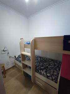 a bunk bed room with two bunk beds at Nueva casita de colores in Elche