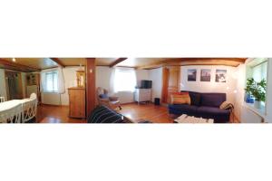 a living room with a couch and a bed and a room at Stony in Brösarp