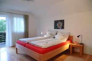 Ένα ή περισσότερα κρεβάτια σε δωμάτιο στο Ferienhaus Murmel