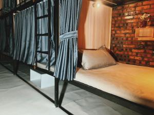 Ένα ή περισσότερα κρεβάτια σε δωμάτιο στο Venn Hostels