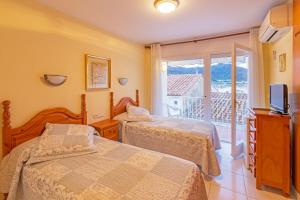 Postel nebo postele na pokoji v ubytování Habitacions La Font
