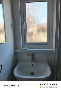 a white sink in a bathroom with a window at Tolroy manor holiday cottage in Saint Erth +55 photos