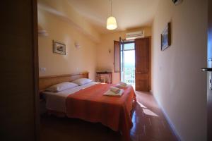 Postel nebo postele na pokoji v ubytování Hotel-Pensione 4 Stagioni