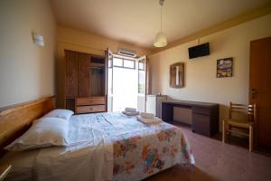 Postel nebo postele na pokoji v ubytování Hotel-Pensione 4 Stagioni