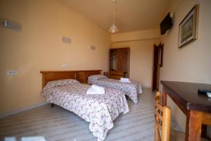 Postel nebo postele na pokoji v ubytování Hotel-Pensione 4 Stagioni