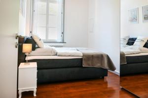 Ένα ή περισσότερα κρεβάτια σε δωμάτιο στο Römer-Apartment