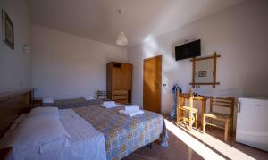 Postel nebo postele na pokoji v ubytování Hotel-Pensione 4 Stagioni