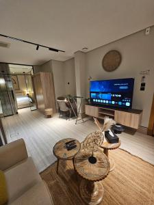 a living room with a couch and a tv at سدارا للأجنحه الفندقيه in Riyadh +16 photos