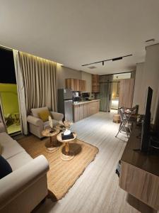 a living room with a couch and a table at سدارا للأجنحه الفندقيه in Riyadh