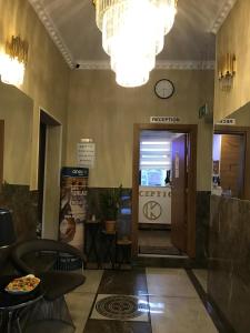 a lobby of a building with a door and chandelier at Kispet Deluxe Hotels&Suites in Oberhausen