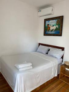 Postel nebo postele na pokoji v ubytování Hotel El Encanto