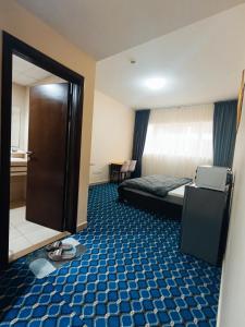 Posezení v ubytování Yasmeen Master Suite Rooms