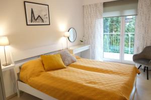 Posteľ alebo postele v izbe v ubytovaní Apartament Bukovy Wisła
