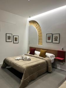 a bedroom with a large bed in a room at Rosy Room Design in Marsala +26 photos