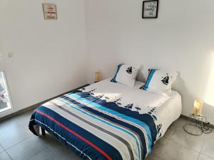 Postel nebo postele na pokoji v ubytování Appartement à 50 m de la mer, idéal famille