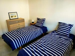 Postel nebo postele na pokoji v ubytování Appartement à 50 m de la mer, idéal famille