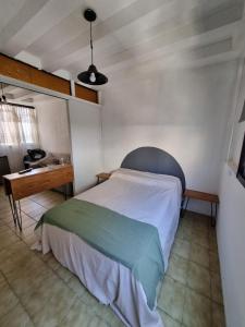 Ένα ή περισσότερα κρεβάτια σε δωμάτιο στο Complejo 9 de Julio