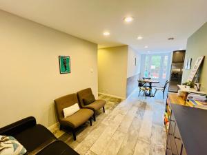 a living room with a couch and chairs and a table at Private Room3 Own Entry Shared Bath One Guest Walk to UCSD in San Diego