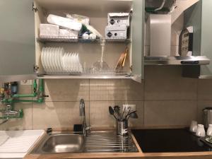 a kitchen counter with a sink and a sink at B&B Rome Vatican Residence in Rome +117 photos