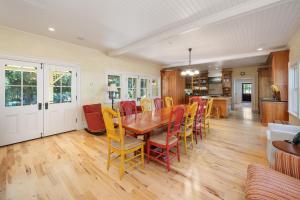 a kitchen and dining room with a wooden table and chairs at 1800s Victorian Home- Halter Ranch in Adelaida