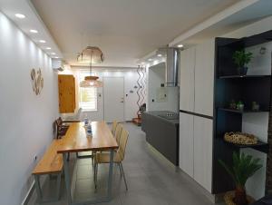 a kitchen and dining room with a wooden table in a room at TH with private pool in Pampatar, Venezuela in Pampatar