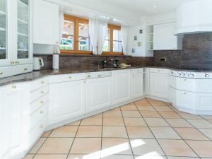 Kuchyň nebo kuchyňský kout v ubytování Orion - Luxuriöse Duplex Wohnung in Grindelwald