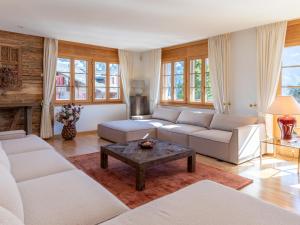 Posezení v ubytování Orion - Luxuriöse Duplex Wohnung in Grindelwald + 24 fotografií
