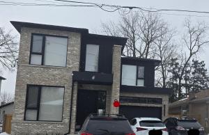 a house with cars parked in front of it at Spacious Bright 9ft Ceiling with Private Entrance in Milton