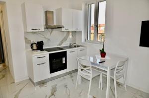 Kuchyň nebo kuchyňský kout v ubytování Residence JASMIN 2P + 6 fotografií