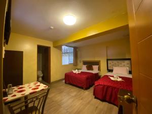 Gulta vai gultas numurā naktsmītnē Hotel SPRING