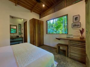 Voodi või voodid majutusasutuse Satta Lodge toas