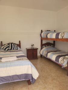 Ένα ή περισσότερα κρεβάτια σε δωμάτιο στο Casa Su Termal