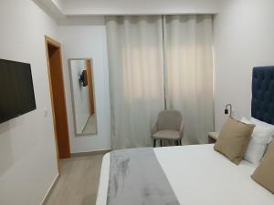 Letto o letti in una camera di Charming House Tarrafal