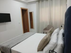 Letto o letti in una camera di Charming House Tarrafal