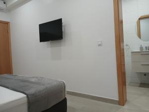 TV o dispositivi per l'intrattenimento presso Charming House Tarrafal