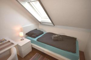 Postel nebo postele na pokoji v ubytování Ferienwohnung Zwergpinscher