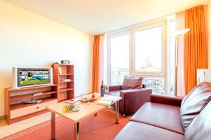TV a/nebo společenská místnost v ubytování Residenz Meeresblick D Fewo 113