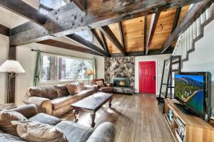 a living room with a couch and a tv at Stay Cool! AC - Foosball - Nature Escape in South Lake Tahoe +26 photos