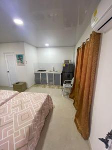 Voodi või voodid majutusasutuse Posada Three Cay Suites toas