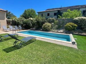 a swimming pool in the yard of a house at Villa in Vaison near Roman Ruins & Pool in Vaison-la-Romaine