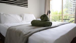 Postel nebo postele na pokoji v ubytování Breeze Inn Gold Coast