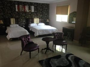 Rúm í herbergi á Hotel Arisu