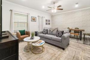 a living room with a couch and a table at Pensacola Paradise Downtown in Pensacola +38 photos