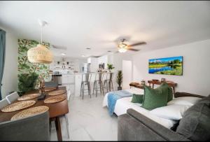 a living room with a couch and a table at House in the Heart Of Miami in Miami