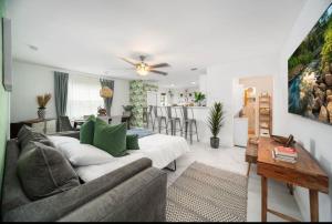 a living room with a couch and a table at House in the Heart Of Miami in Miami