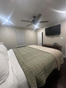 a bedroom with a bed and a ceiling fan at Home in North Wilmington in Wilmington