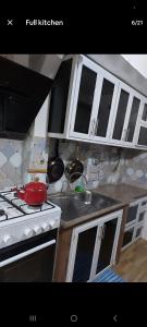 Kitchen o kitchenette sa Studio room transient neo Calapan