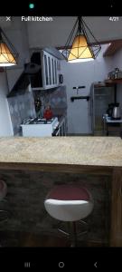 Kitchen o kitchenette sa Studio room transient neo Calapan