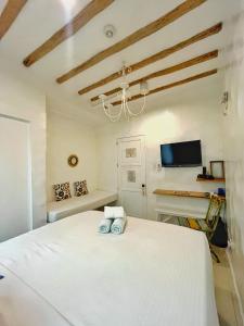 TV a/nebo společenská místnost v ubytování Lugar Bonito Hotel + 37 fotografií