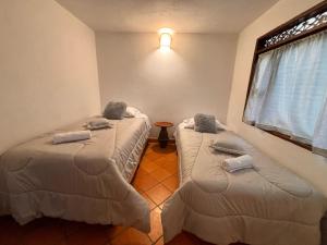 Postel nebo postele na pokoji v ubytování Casa Xiscua